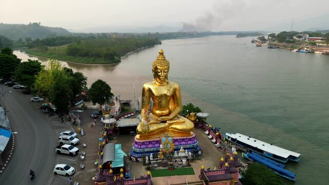 Golden Triangle of Big Buddha, Thailand. Travel Landscapes. Forest fire in the background. Smog in the air