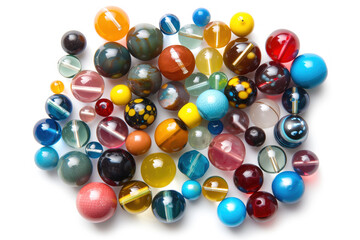 A bunch of colorful glass beads are scattered on a white background