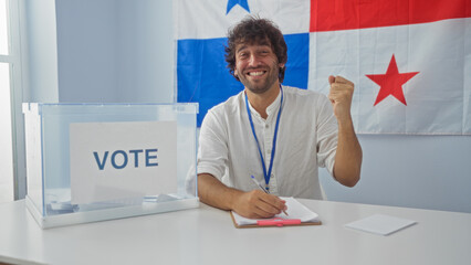 Young man voting in an election with the panamanian flag in the background, showing success and...