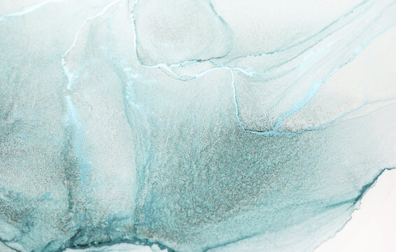 An abstract watercolor painting featuring a tranquil blend of aqua, blue, and white hues. The swirling patterns create a calming and ethereal effect