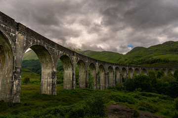 Fototapeta premium Glenfinnan viaduct. Jacobite steam train. Scotland, United Kingdom. West Scottish Highlands.