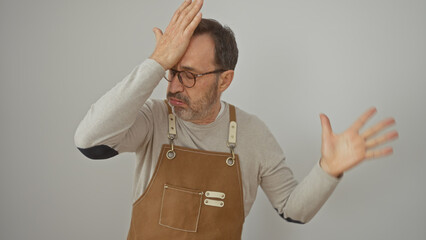 Middle-aged man in apron expressing dismay or confusion against a white background.