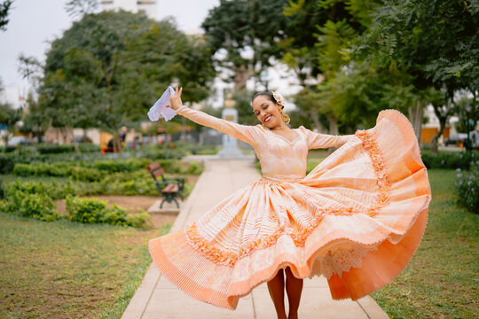 Dancer performing peruvian marinera dance in traditional dress