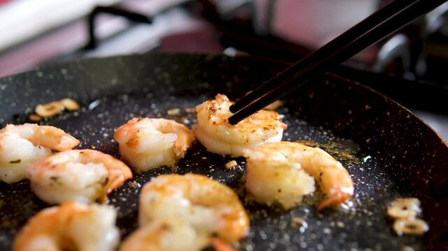 fry shrimps. process of cooking flour fried shrimp is by deep frying in oil until golden brown and crispy in texture