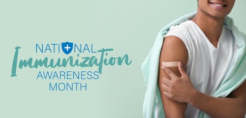 Young African-American boy after vaccination on light blue background. Banner for National...