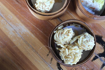  Rambutan Shrimp or Crispy Dimsum Chinese Dumplings Layered with Shrimp with Noodles. one of the menus at the Gacoan noodle restaurant. Served with Sauce