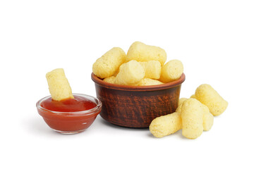 Bowl with tasty corn sticks and ketchup on white background