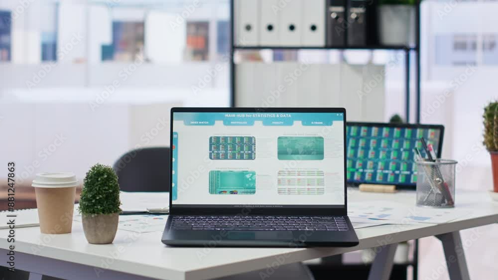 Aufkleber financial analyst workplace featuring laptop and tablet displaying stock exchange data and statistic