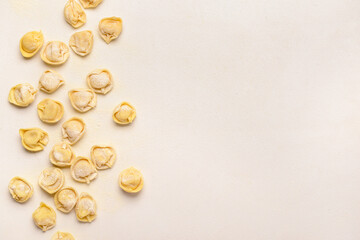 Fresh raw dumplings on white background