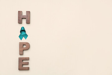 Teal ribbon and word HOPE on beige background. Sexual Assault Awareness Month