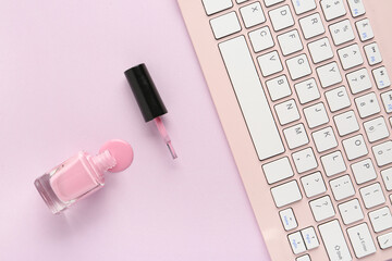 Bottle of nail polish and modern keyboard on color background, closeup