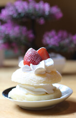plate of donut cream with strawberries