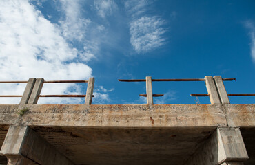 Obraz premium Concrete bridge is damaged and rusted.