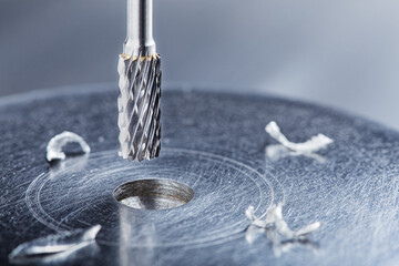 Milling cutter make sink in hole in steel billet. Locksmith work.