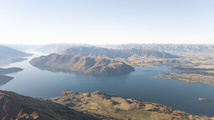 View of Lake Wanaka between the mountains from top of Roys Peak in Wanaka, New Zealand