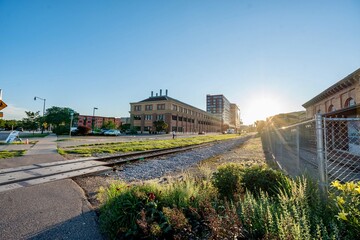 Old Train Station with an old abandoned train near abandoned and in front of the renovated station near downtown Madison, WI during the Golden Hour