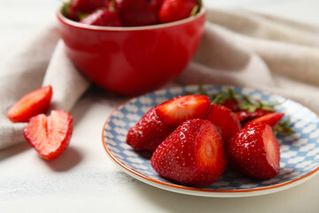 Plate with fresh sweet strawberries on white background, closeup