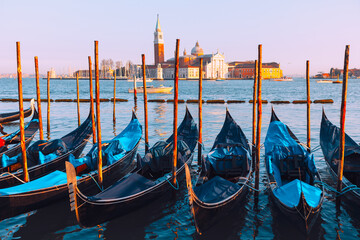 Moored Gondolas and San Giorgio Maggiore church view in Venice, Italy © Leilani
