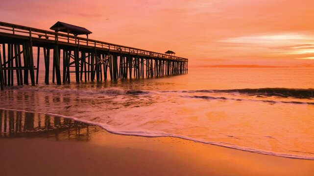 Sunrise and Wooden Pier on Fernandina Beach, Amelia Island, Florida, USA