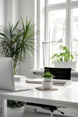 A laptop computer sits on top of a white desk, ready for use