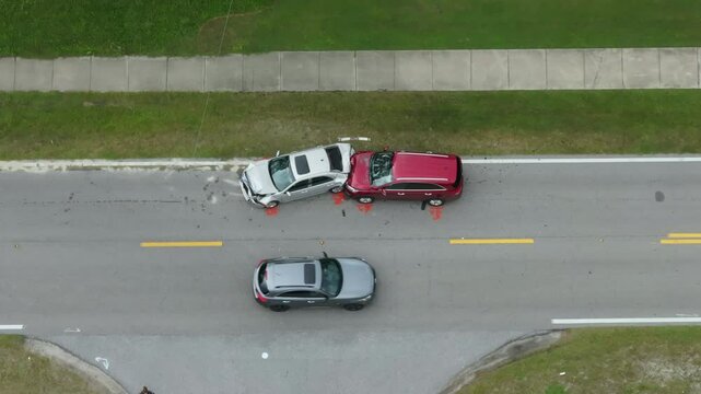 Car accident on highway road in Florida. Emergency services personnel helping victims of vehicle crash on city street in USA.