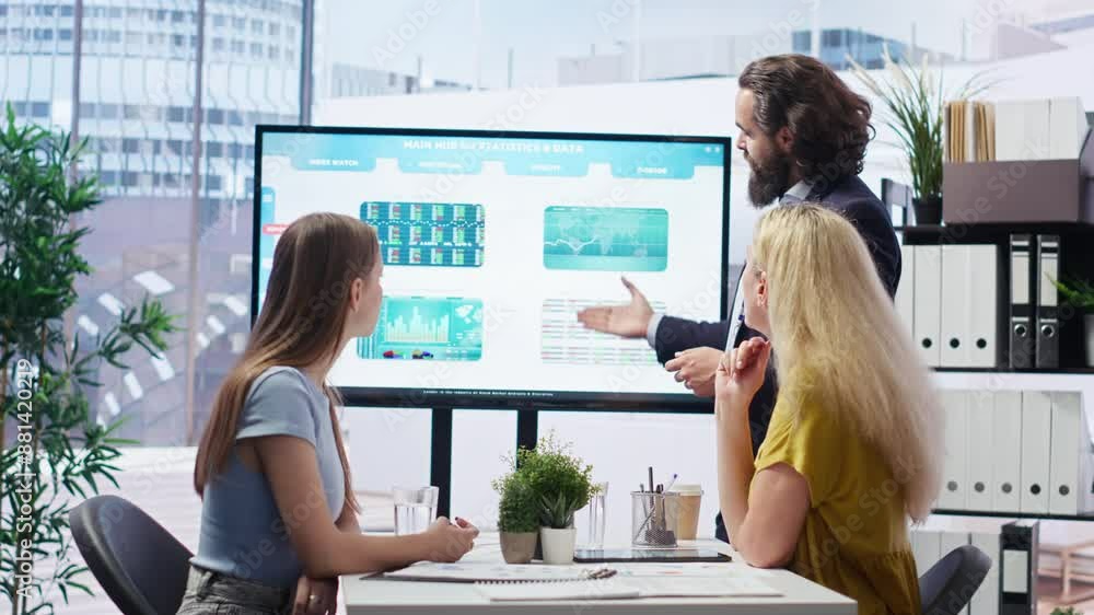 Poster financial adviser presents market analytics to customers using large display, explore best practices