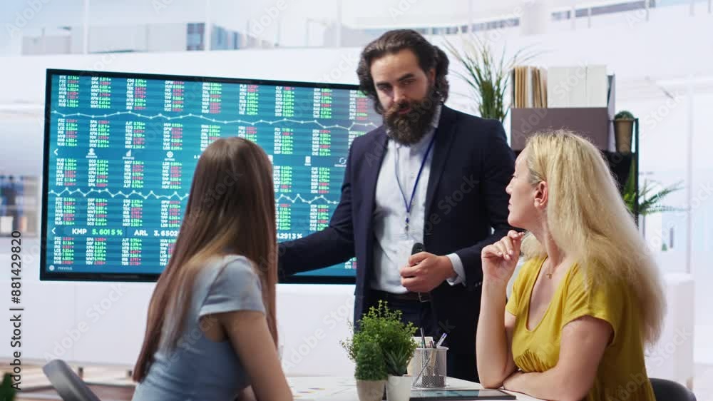 Poster financial adviser presents market analytics to clients using large screen, emphasizing data driven d