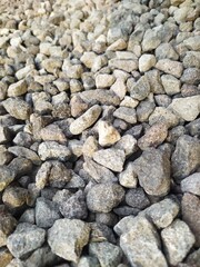 The texture of gravel stones on neatly arranged ground.