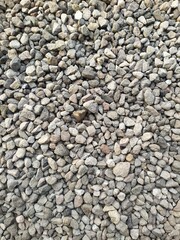 Pebbles are often used in home yards due to their practical and aesthetic functions.