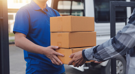 Asian delivery express courier young man use giving boxes to woman customer he wearing protective face mask at front home