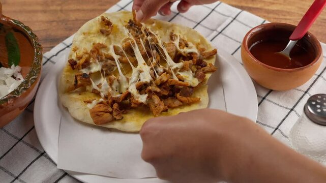 Taco al pastor known as gringa made of flour tortilla, Mexican cheese and pork