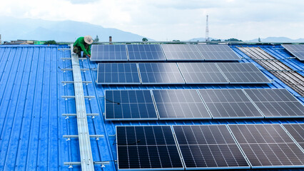 engineer man inspects construction of solar cell panel or photovoltaic cell by electronic device....