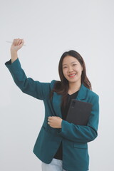 Attractive elegant young asian business woman using digital tablet standing on isolated background. Happy young latin female formal black suit holding tablet gadget working service with customer