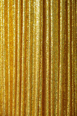 The golden curtains shimmered in wavy waves.