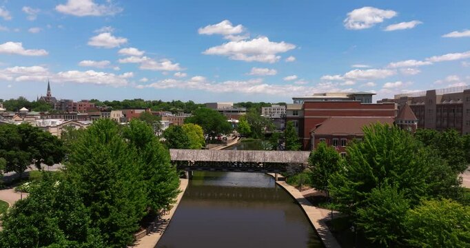 Forward Drone Shot Above DuPage River in Downtown Naperville, Illinois. Chicago Suburb