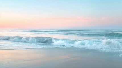 Fototapeta premium Tranquil Ocean Waves at Sunrise - A serene sunrise over the ocean with gentle waves crashing on the sandy shore. The soft pastel colors create a calming atmosphere. - A serene sunrise over the ocean w