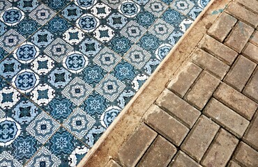 Beautiful blue ceramic moroccan tiles ground flooring interior design isolated on horizontal ratio outdoor bricks background.
