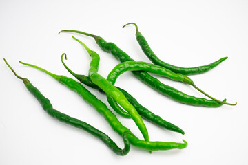 Curly green chilies in clusters. typical Indonesian. isolated on white background.