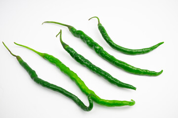 Curly green chilies in clusters. typical Indonesian. isolated on white background.