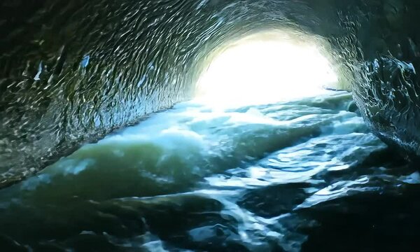 A concrete tunnel with water flowing swiftly through it (mov)