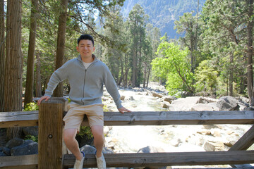 Fototapeta premium smile Asian man tourist in Yosemite National Park in California, USA