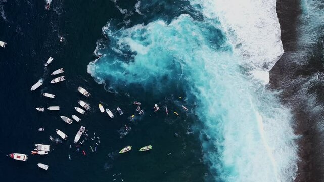 Surfing contest Teahupoo Tahiti aerial drone surf contest birdseye view perspective French Polynesia boats surf wave 2024 Pacific Ocean coral reef Channel Point Faremahora Pass Havae static shot