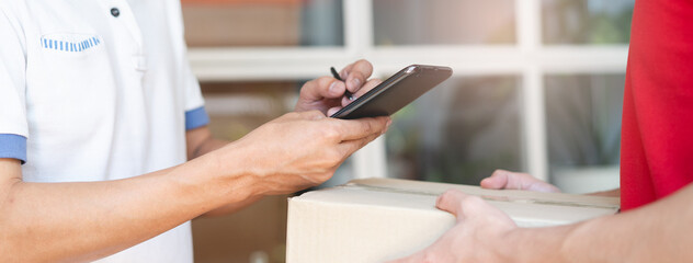 Delivery Man sending package to receiver on doorway.