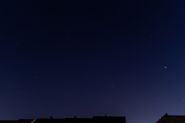 Starry night sky over urban silhouette - celestial display meets cityscape. Taken in Toronto, Canada.