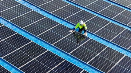 Worker Technicians are working to construct solar panels system on roof. Installing solar photovoltaic panel system. Men technicians walking on roof structure to check photovoltaic solar modules.