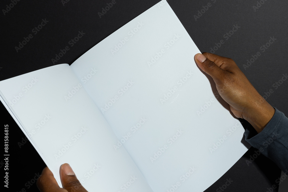 Canvas Prints African American man holding an open book, with copy space