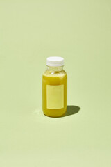 Yellow Detox Smoothie in Bottle - Pear Juice, Yellow Pepper, Turmeric; Minimalist Pastel Creative Color Pattern