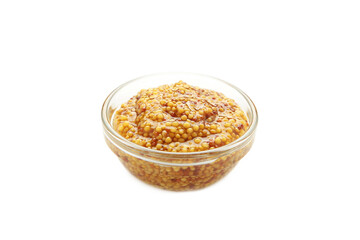 French grain mustard in bowl isolated on white background.