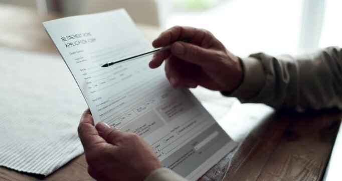 Person, hands and registration form in nursing home for agreement and consent approval. Senior patient, pensioner and contract or paperwork with information, rules and application for accommodation