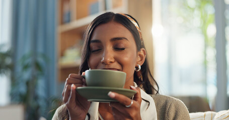 Coffee, cup and indian woman for relax in home, smell and aroma for comfort and scent. Living room,...